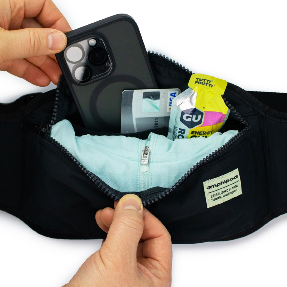 Detail view of Amphipod R3 Venture Out Convertible Pack with example items to store inside.