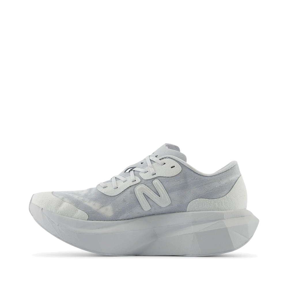 Side (left) view of New Balance District Vision x New Balance Fuel Cell Super Comp Elite v4 Sneaker for men.
