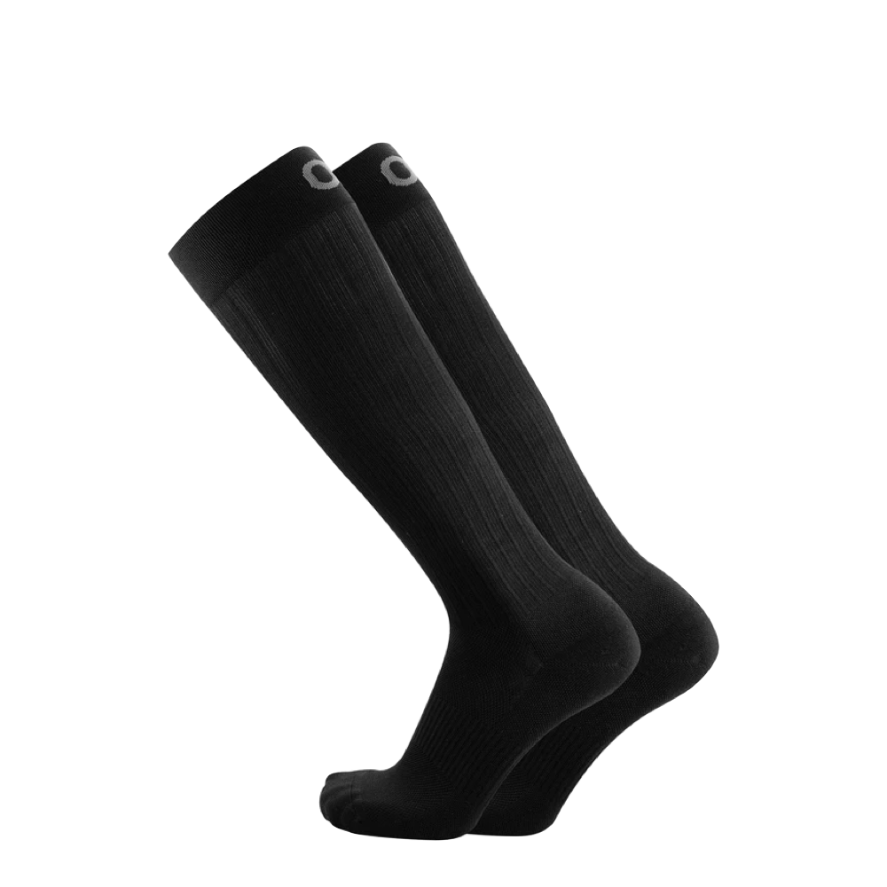 Side (left) view of OS1st Over the Calf Compression Travel Socks for women.