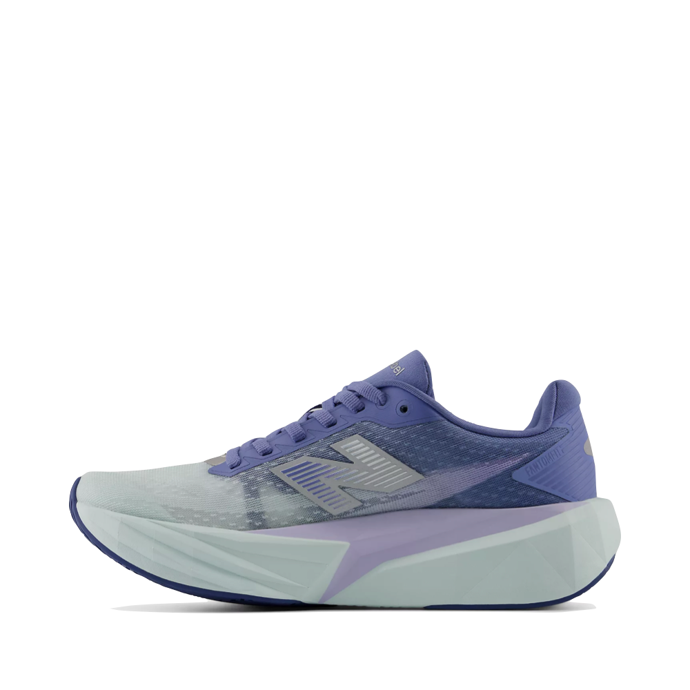 Side (left) view of New Balance Fuel Cell Rebel v5 Sneaker for women.
