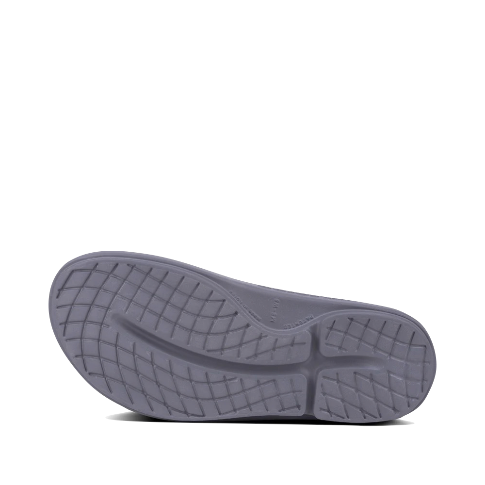Bottom view of OOfos OOahh Slide Sandal for unisex.