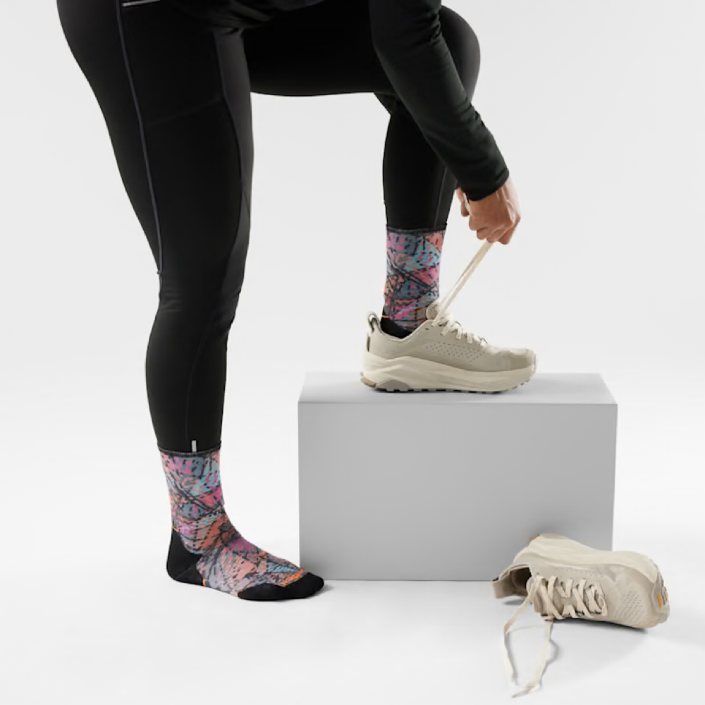 Model view of Smartwool Tail Run Triangle Prism Print Targeted Cushion Crew Sock.